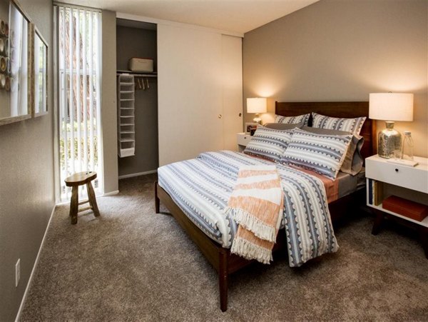 Vicino Apartments: Cozy bedroom featuring modern design and plush bedding for a luxurious living experience