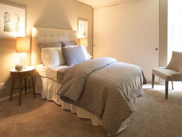 Modern bedroom featuring elegant decor and natural light in Vicino Apartments