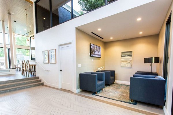 Clubhouse with modern decor and comfortable seating at Vicino Apartments