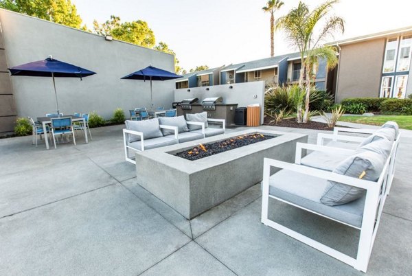 Cozy outdoor fire pit area at Vicino Apartments, perfect for gathering and relaxation