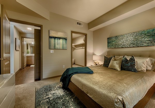 Cozy bedroom with stylish decor at Summerly at Zanjero Apartments