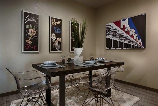 Dining area with stylish lighting and modern furniture at Summerly at Zanjero Apartments