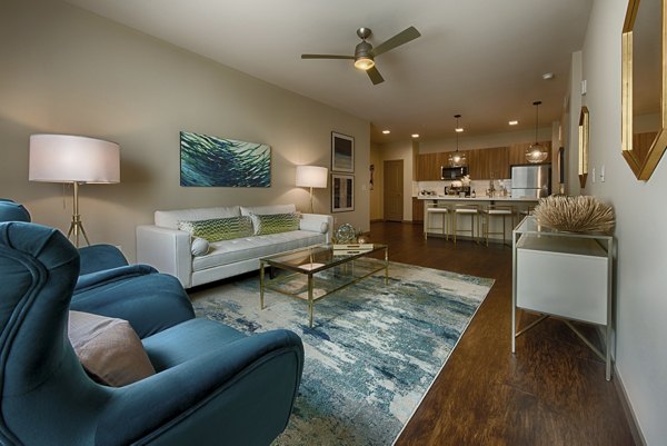 Spacious living room with modern decor at Summerly at Zanjero Apartments