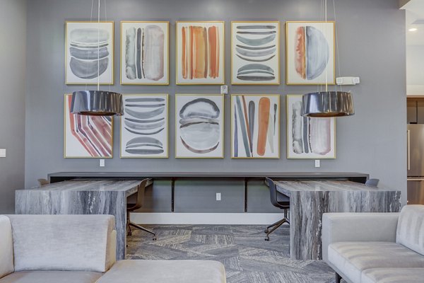Stylish clubhouse with modern decor at Anthology Apartments, perfect for social gatherings and events