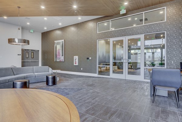 Elegant clubhouse with modern decor at Anthology Apartments, perfect for social gatherings and community events