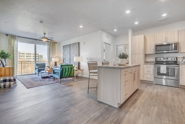 Modern kitchen with stainless steel appliances at Anthology Apartments offering luxury living