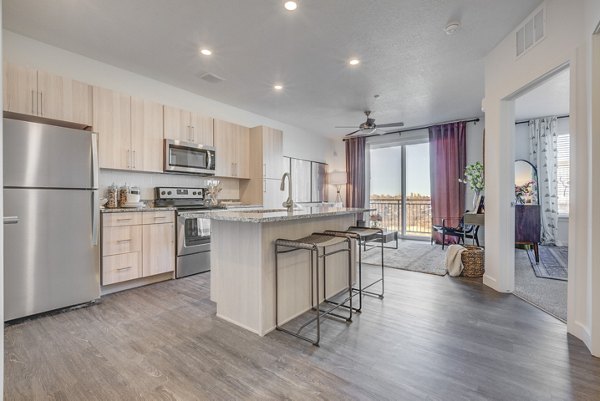 Spacious kitchen with modern appliances at Anthology Apartments, luxury living space in a vibrant community