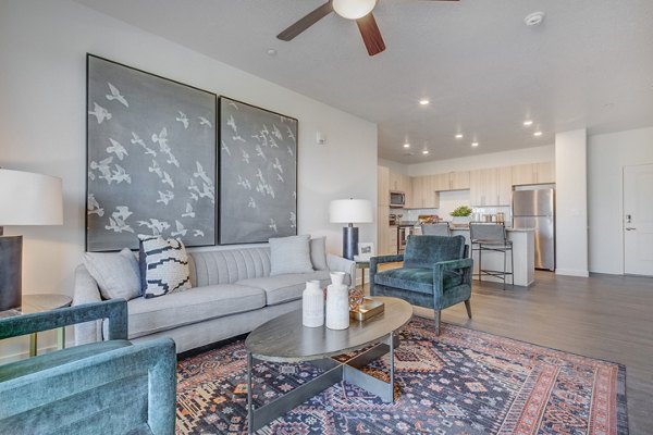 Living room with modern decor and open layout in Anthology Apartments
