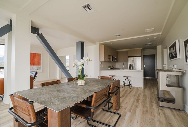 Dining area with modern furnishings at 47Hundred Apartments, offering a luxurious dining experience