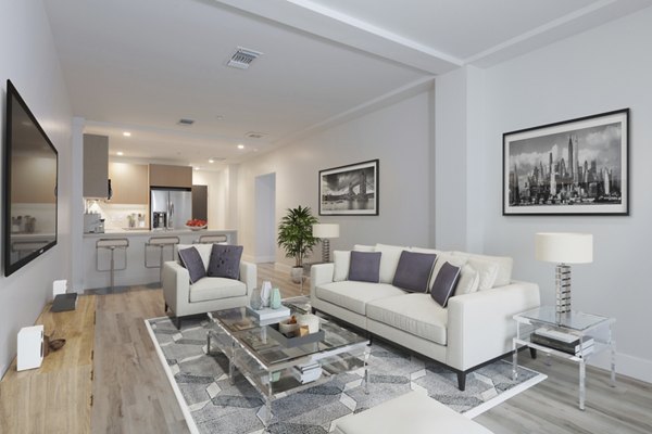 Elegant living room with modern decor at 47Hundred Apartments, showcasing luxury living by Greystar