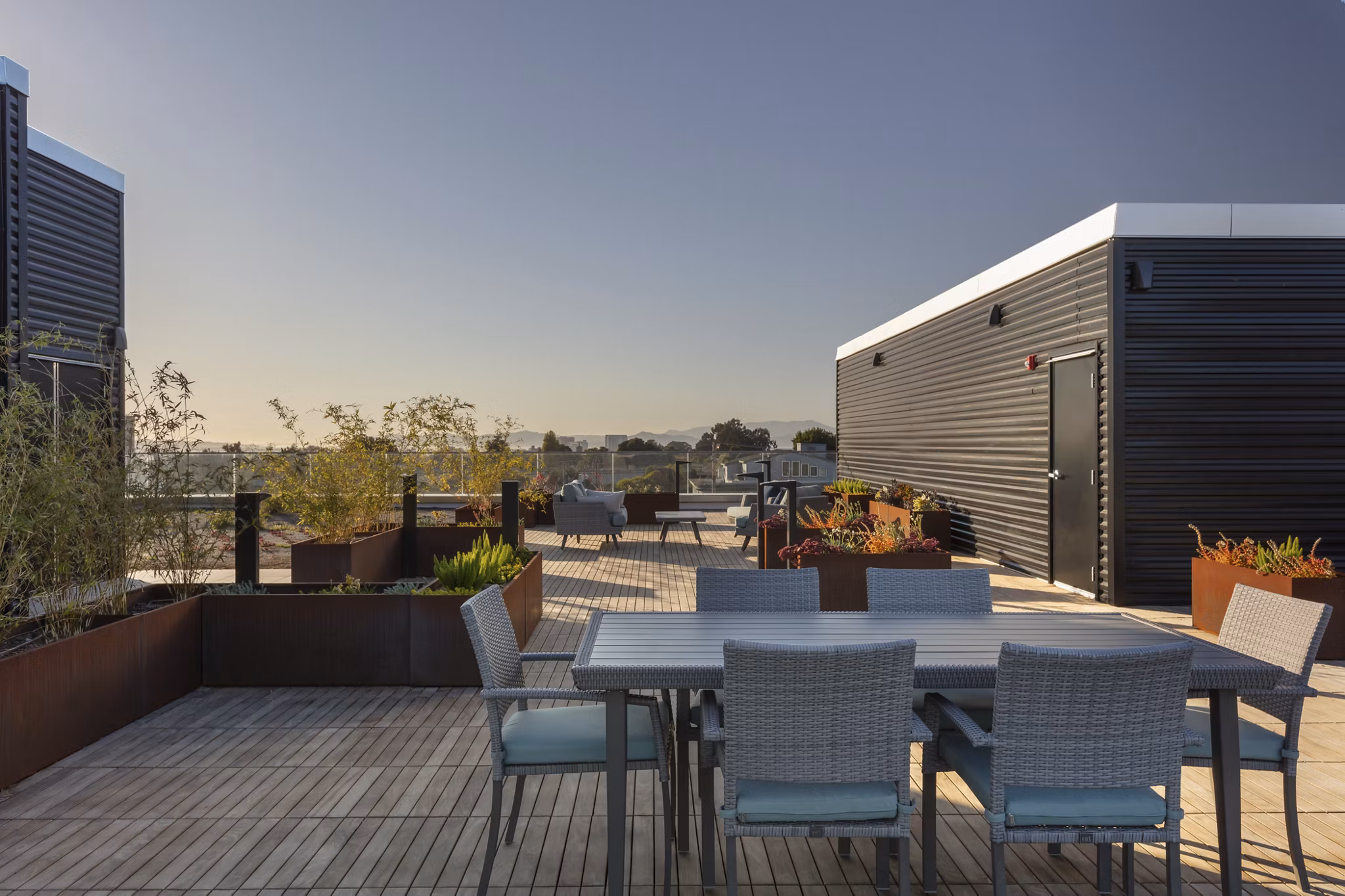 Rooftop deck with stylish seating and skyline views at 47Hundred Apartments