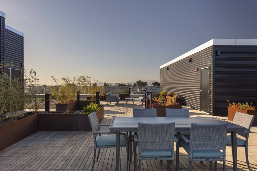 Rooftop deck with stylish seating and skyline views at 47Hundred Apartments