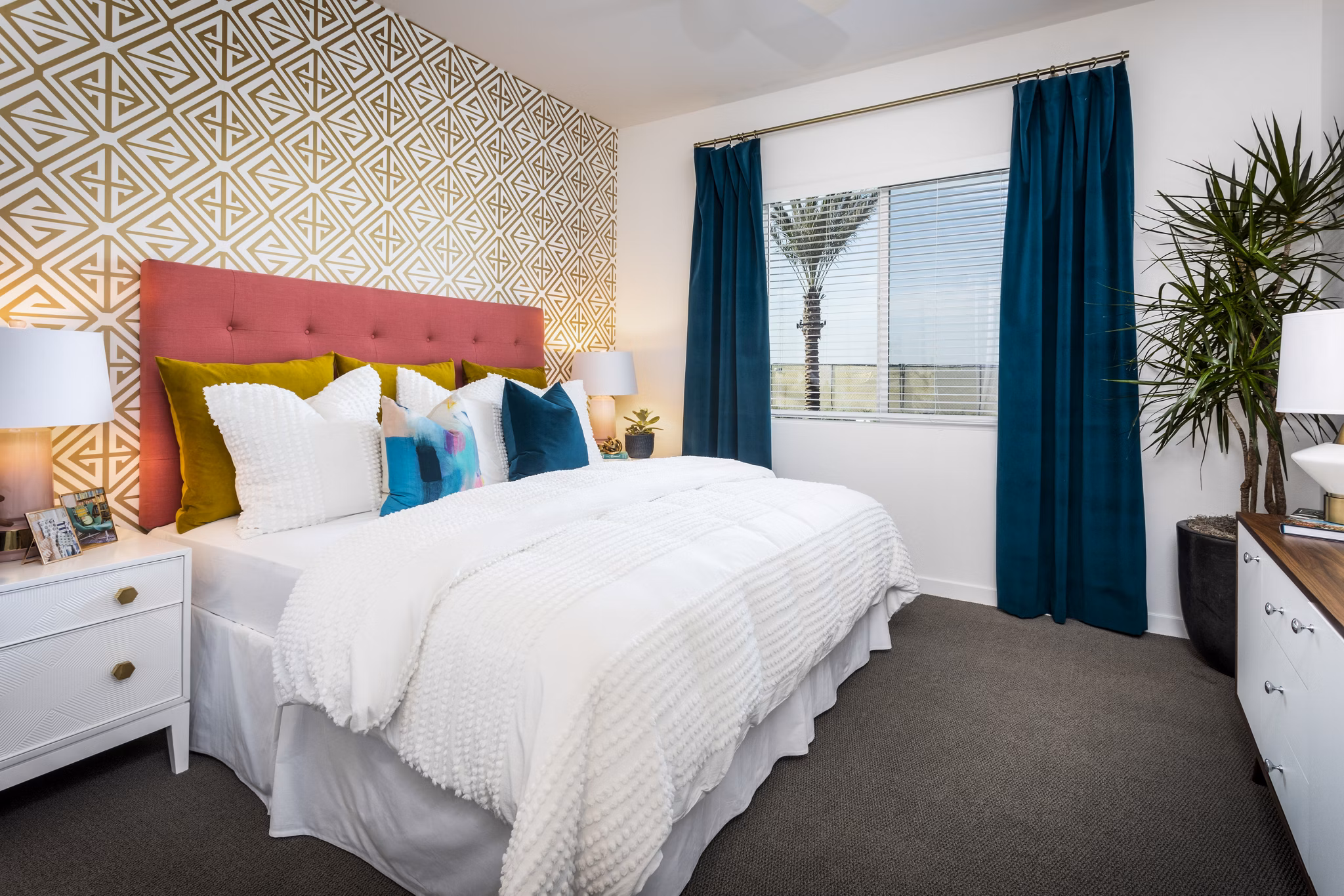 Elegant bedroom featuring stylish decor and large windows at Rivue Apartments, luxury living in a Greystar-managed community