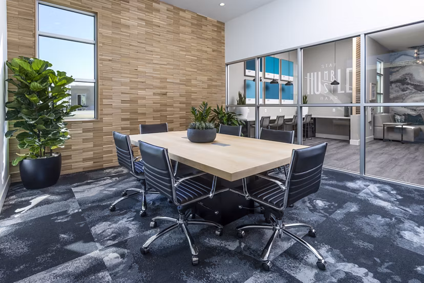 Modern meeting facility with conference setup at Rivue Apartments, ideal for business gatherings and events