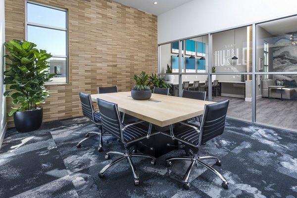 Modern meeting facility with conference setup at Rivue Apartments, ideal for business gatherings and events