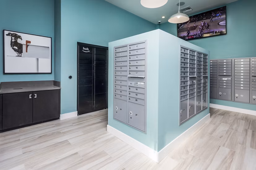 Mailroom featuring organized parcel lockers at Rivue Apartments