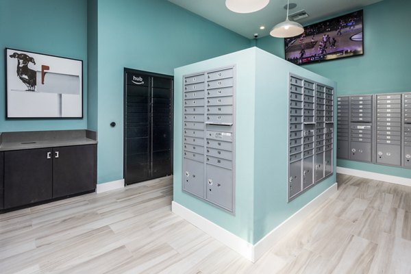 Mailroom featuring organized parcel lockers at Rivue Apartments