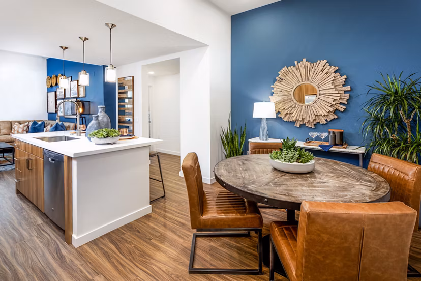 Dining area with modern decor and elegant lighting in Rivue Apartments luxury residence