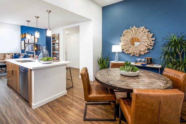 Dining area with modern decor and elegant lighting in Rivue Apartments luxury residence