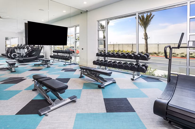 State-of-the-art fitness center featuring modern equipment at Rivue Apartments luxury community