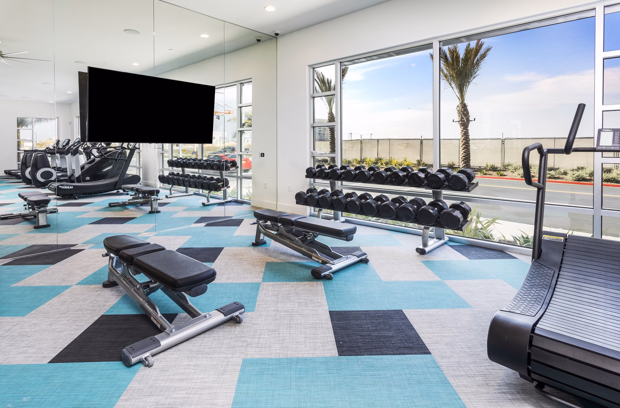State-of-the-art fitness center featuring modern equipment at Rivue Apartments luxury community