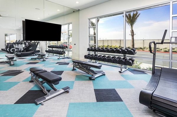 State-of-the-art fitness center featuring modern equipment at Rivue Apartments luxury community