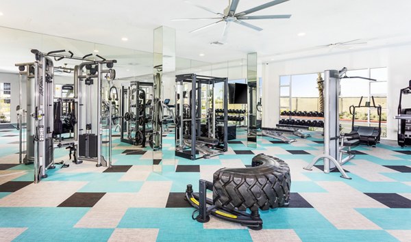 Fully-equipped fitness center with modern machines at Rivue Apartments