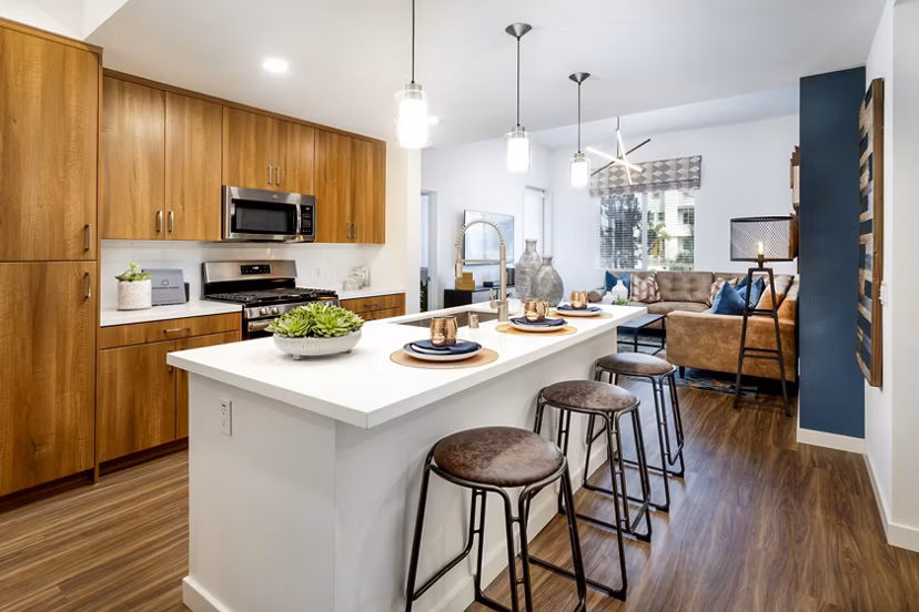 Modern kitchen with stainless steel appliances at Rivue Apartments
