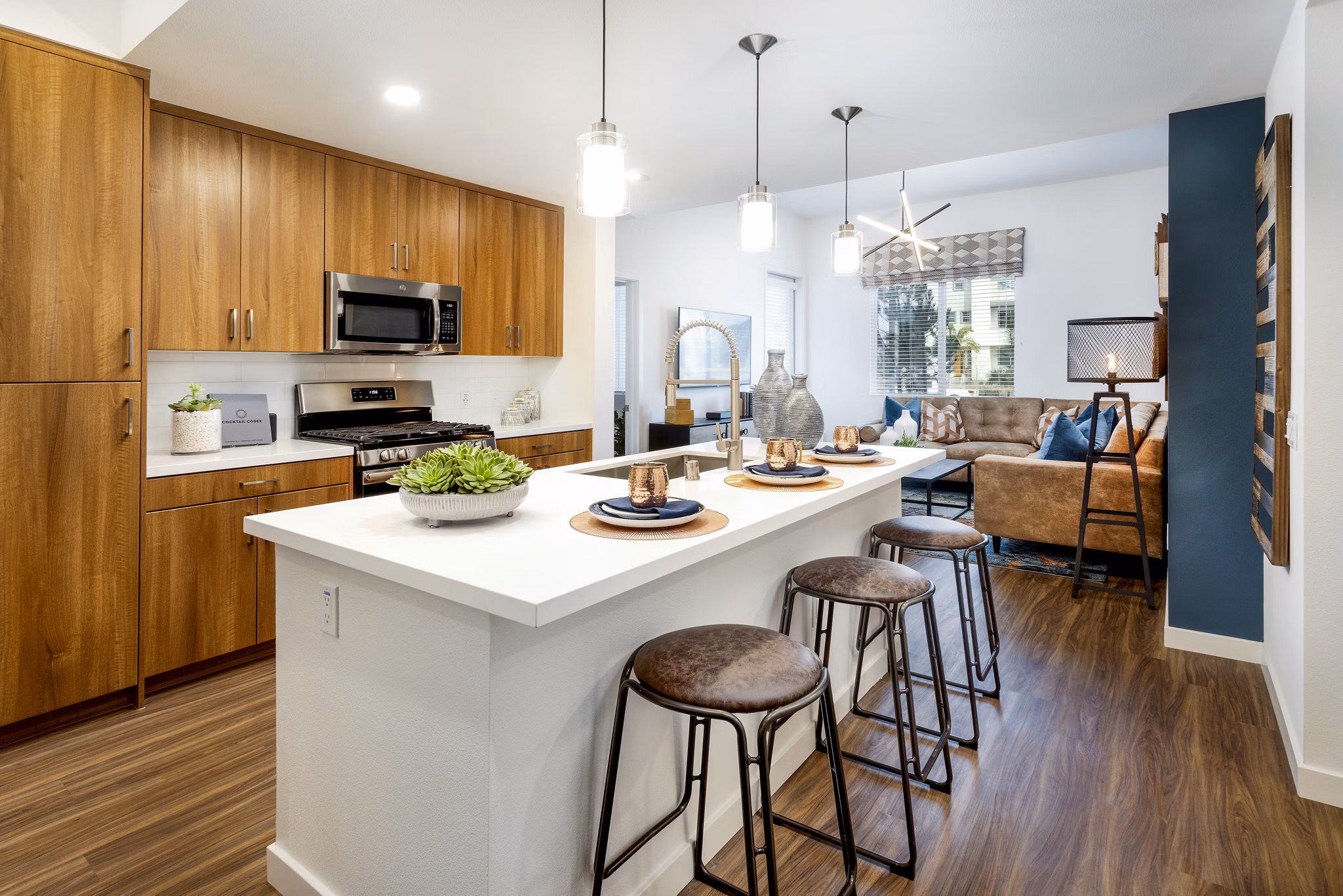 Modern kitchen with stainless steel appliances at Rivue Apartments