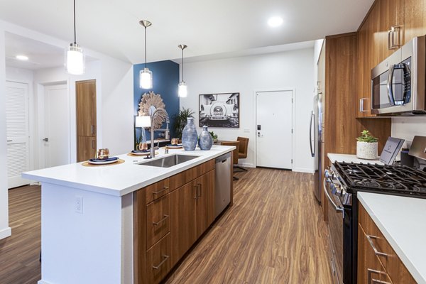 Modern kitchen with sleek appliances in Rivue Apartments offering luxury living