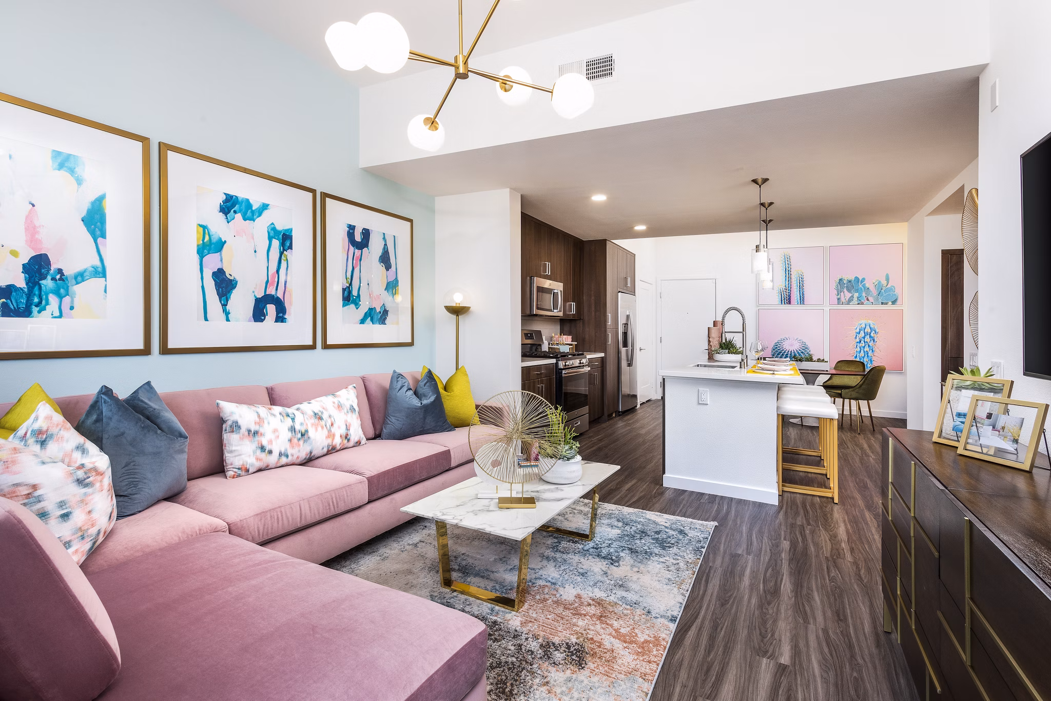 Spacious living room with modern decor at Rivue Apartments