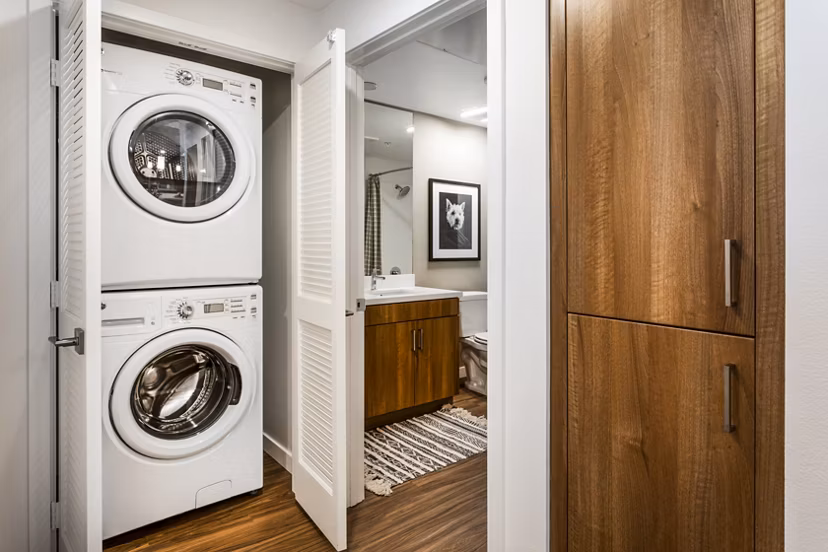 Laundry Room at Rivue Apartments: Modern laundry facilities with energy-efficient washers and dryers in a convenient setting for residents