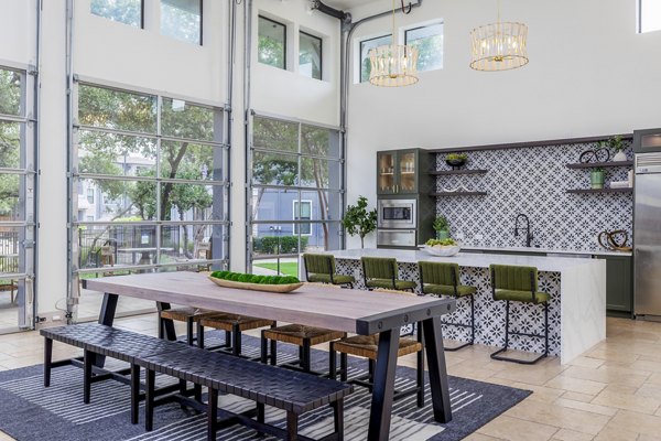 Clubhouse kitchen with modern appliances at The Monterra Apartments, offering a luxury community space for residents