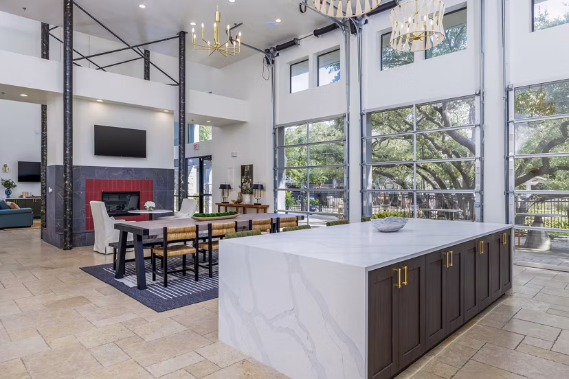 The Monterra Apartments: Modern clubhouse kitchen featuring sleek appliances and inviting seating areas