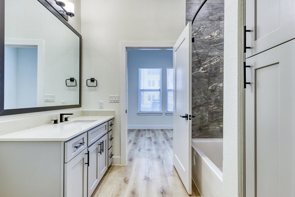 Modern bathroom with sleek fixtures featuring luxury design at The Tobin Estate Apartments