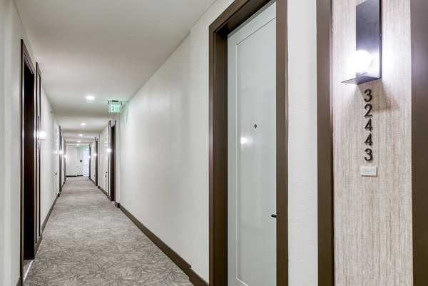 Hallway featuring modern lighting and decor at The Tobin Estate Apartments, a Greystar luxury property