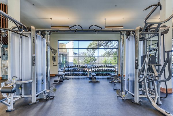 State-of-the-art fitness center at The Tobin Estate Apartments with modern equipment and spacious layout
