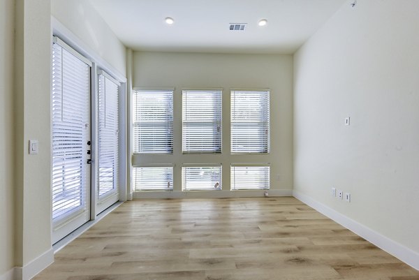 Spacious living room with modern dÃ©cor at The Tobin Estate Apartments