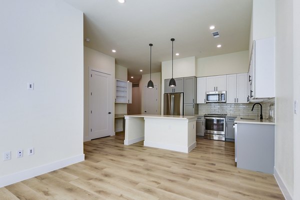 Spacious living room with modern decor in The Tobin Estate Apartments