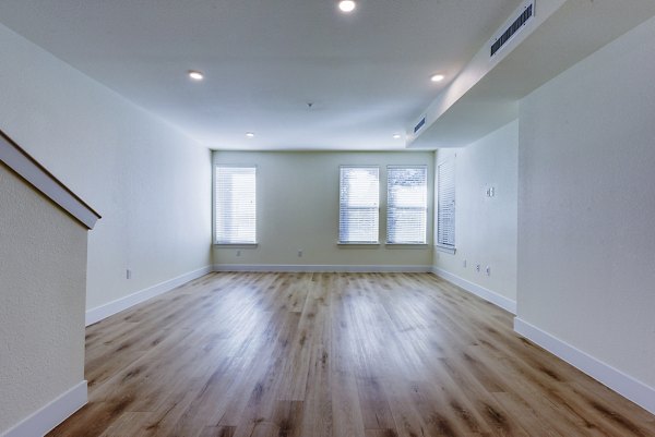 Cozy living room with modern decor at The Tobin Estate Apartments, offering luxury living in a serene setting