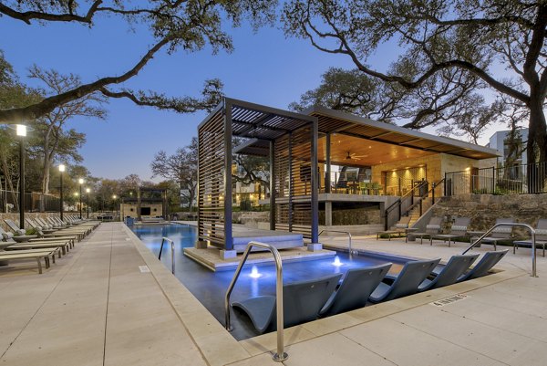 Luxurious pool at The Tobin Estate Apartments with cabanas and lounge chairs for residents to relax and enjoy
