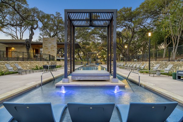 Modern outdoor patio with cozy seating area at The Tobin Estate Apartments