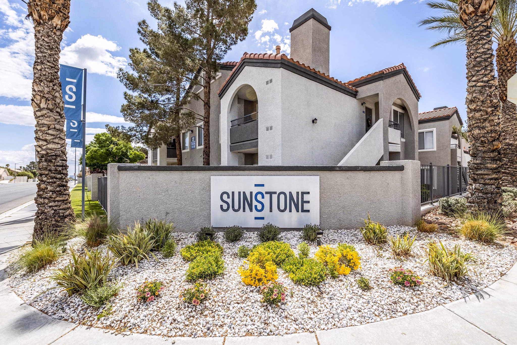 Sunstone Apartments: Modern signage at luxury property in vibrant city location