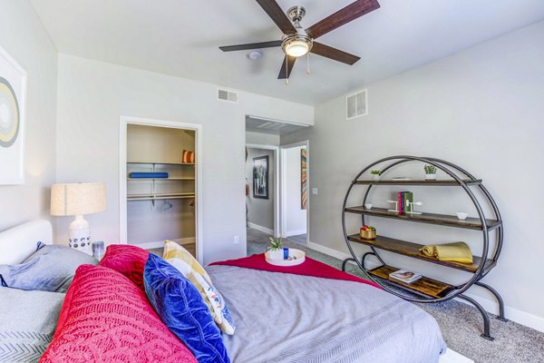 Cozy bedroom with modern furnishings in Sunstone Apartments