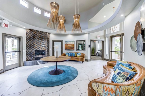 Inviting clubhouse/lobby featuring modern decor and comfortable seating at Sunstone Apartments, perfect for residents to relax and socialize