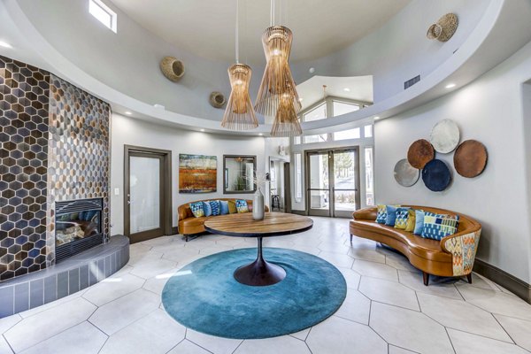 Clubhouse lobby with modern furnishings and open seating at Sunstone Apartments