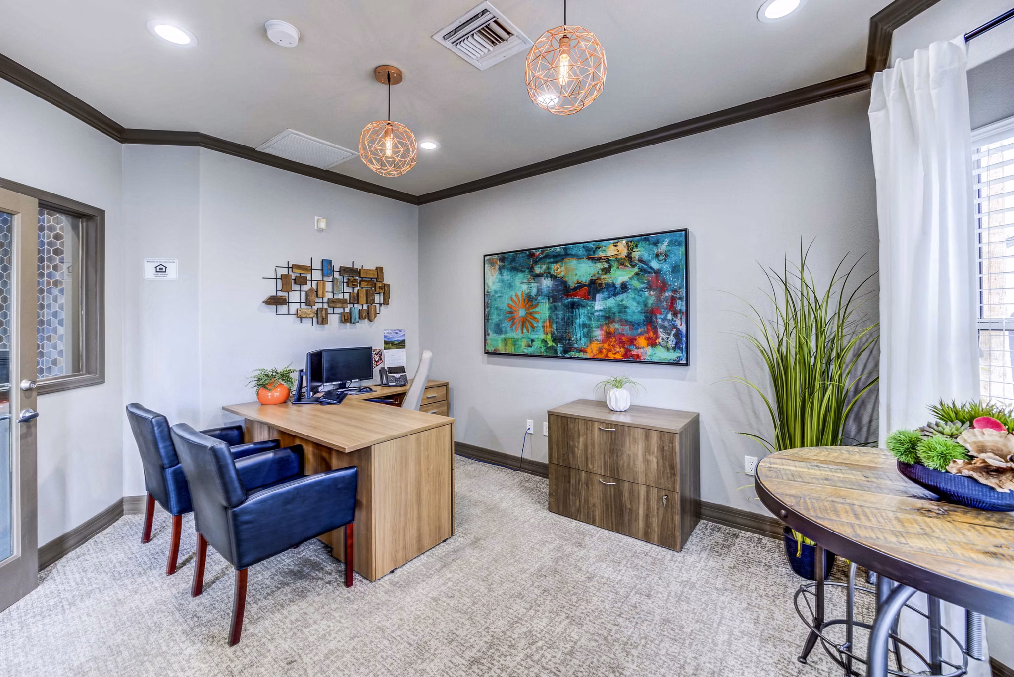 Contemporary clubhouse and leasing office at Sunstone Apartments offering community-focused amenities