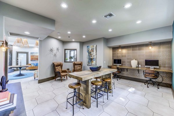Modern clubhouse business center at Sunstone Apartments with luxury design elements, perfect for residents in a Greystar community
