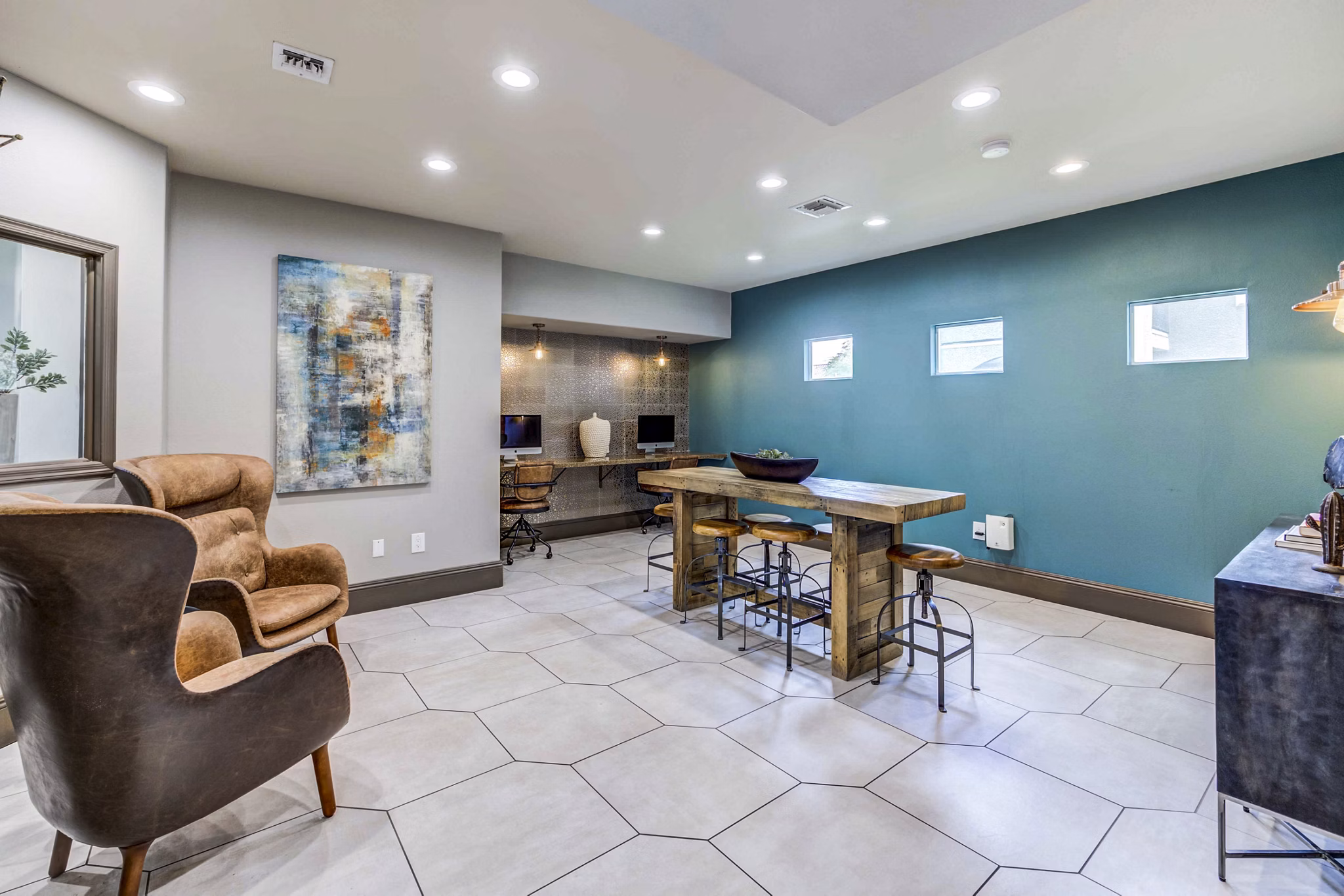 Clubhouse business center with modern workstations at Sunstone Apartments