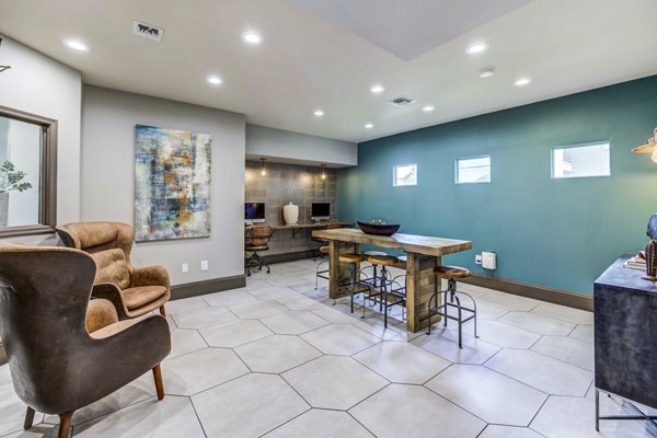 Clubhouse business center with modern workstations at Sunstone Apartments